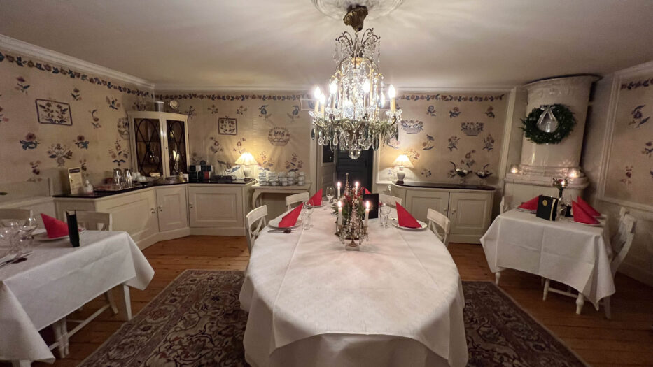 a decorated room ready for christmas dinner at tofta herrgård