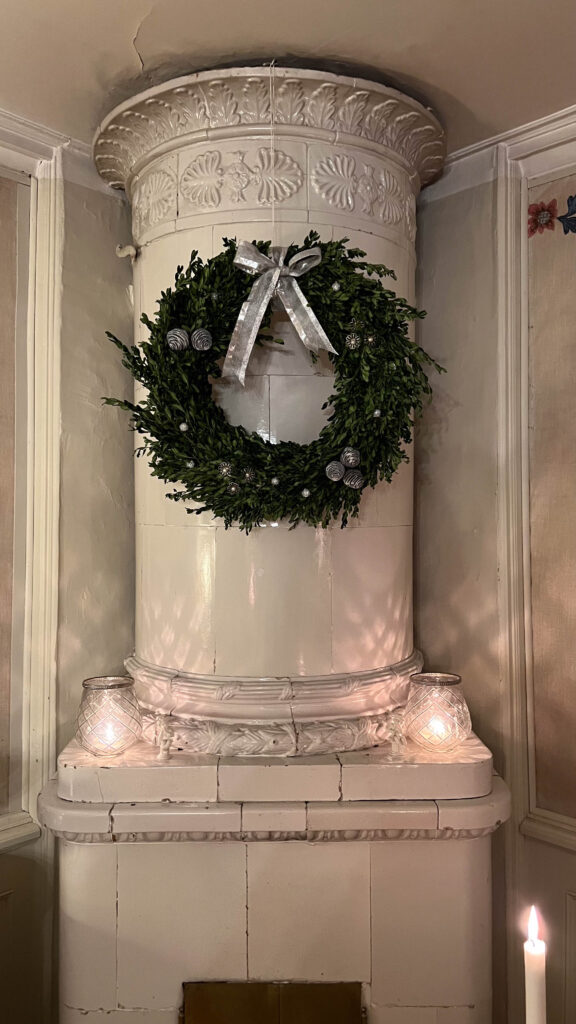 christmas decoration on an old tiled stove