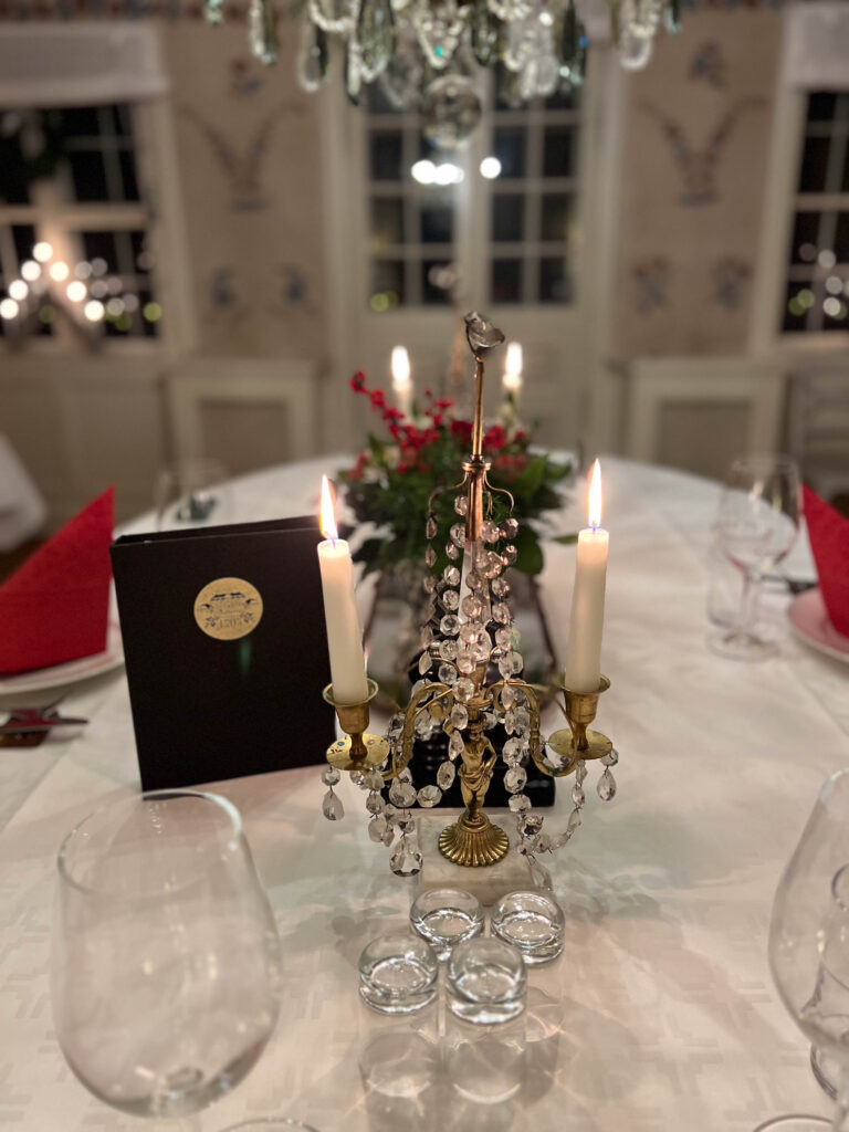 a christmas decorated table at tofta herrgård